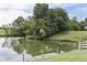 Picturesque pond with a swan and tree-lined banks at 7601 S 700 W, Morgantown, IN 46160