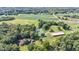 Aerial view of property showing home, pond, and outbuildings at 7601 S 700 W, Morgantown, IN 46160