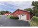 Large red barn with white doors and green lawn at 7601 S 700 W, Morgantown, IN 46160