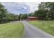 Asphalt driveway leading to main house and garage at 7601 S 700 W, Morgantown, IN 46160