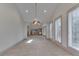 Sunlit dining room with vaulted ceilings and tiled floors at 7601 S 700 W, Morgantown, IN 46160