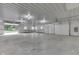 Spacious workshop with high ceilings, concrete floor, and two garage doors at 7601 S 700 W, Morgantown, IN 46160