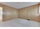Bedroom with wood paneled walls and carpeted floor at 7601 S 700 W, Morgantown, IN 46160