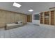 Finished basement room with built-in shelves and a small bed at 7601 S 700 W, Morgantown, IN 46160