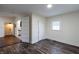 Bright bedroom with wood-look floors and doors to hallway and kitchen at 150 Hurricane St, Franklin, IN 46131