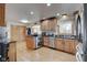 Spacious kitchen with an island, stainless steel appliances, and hardwood floors at 303 Wellington Overlook, Noblesville, IN 46060