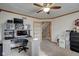 Bright home office features built-in shelving and a large desk at 303 Wellington Overlook, Noblesville, IN 46060
