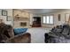 Living room with brick fireplace and comfy sofas at 303 Wellington Overlook, Noblesville, IN 46060
