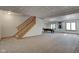 Finished basement with a pool table and staircase at 303 Wellington Overlook, Noblesville, IN 46060