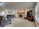 Cozy living room with fireplace and carpeted floors at 303 Wellington Overlook, Noblesville, IN 46060