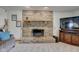 Brick fireplace as a focal point in the living room at 303 Wellington Overlook, Noblesville, IN 46060