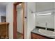 Convenient wet bar with a sink and shelving in the basement at 303 Wellington Overlook, Noblesville, IN 46060