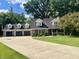 Two-story home with a three car garage and a large yard at 303 Wellington Overlook, Noblesville, IN 46060