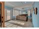 Relaxing screened-in porch with a hot tub at 303 Wellington Overlook, Noblesville, IN 46060