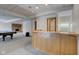 Basement with a curved bar, fireplace, and pool table at 303 Wellington Overlook, Noblesville, IN 46060