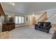 Spacious living room with a view of entryway and stairs at 303 Wellington Overlook, Noblesville, IN 46060