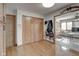 Bright hallway with hardwood floors and coat hooks at 303 Wellington Overlook, Noblesville, IN 46060