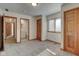 Well-lit bedroom with access to a full bathroom and hallway at 303 Wellington Overlook, Noblesville, IN 46060