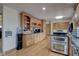Open kitchen with custom cabinetry and granite countertops at 303 Wellington Overlook, Noblesville, IN 46060