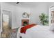 Spacious bedroom with hardwood floors, a fireplace, and access to hallway at 1046 Dawson St, Indianapolis, IN 46203