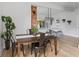 Charming dining space with a wooden table and metal chairs, adjacent to the kitchen at 1046 Dawson St, Indianapolis, IN 46203