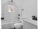 Clean bathroom with white subway tile and black fixtures at 1046 Dawson St, Indianapolis, IN 46203