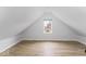Charming attic bedroom with sloped ceilings and hardwood floors at 1046 Dawson St, Indianapolis, IN 46203