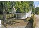 House with backyard, wooden fence, and small porch at 1046 Dawson St, Indianapolis, IN 46203