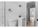 Small bathroom with white vanity, toilet, and tiled walls at 1046 Dawson St, Indianapolis, IN 46203