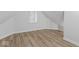 Bright attic bedroom with hardwood floors and a window at 1046 Dawson St, Indianapolis, IN 46203