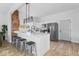 Modern kitchen with white cabinets, stainless steel appliances, and a kitchen island at 1046 Dawson St, Indianapolis, IN 46203