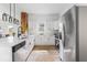 Modern kitchen boasts white cabinets, stainless steel appliances, and a large island at 1046 Dawson St, Indianapolis, IN 46203