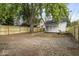 House with gravel driveway and wooden fence at 1046 Dawson St, Indianapolis, IN 46203