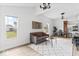 Open concept living area showcasing a gray sofa and views of the kitchen and backyard at 1046 Dawson St, Indianapolis, IN 46203