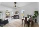 Dining area features a wooden table with metal chairs, and an open view to the living room at 1046 Dawson St, Indianapolis, IN 46203