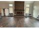 Spacious living room featuring a floor to ceiling stone fireplace and dark tile floors at 3380 N Pine Song Dr, Martinsville, IN 46151