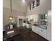 Modern kitchen with white cabinets, dark tile floors, and an island at 3380 N Pine Song Dr, Martinsville, IN 46151