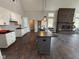 Modern kitchen with white cabinets, dark countertops, and an island at 3380 N Pine Song Dr, Martinsville, IN 46151