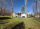 Contemporary home with a mix of materials, a spacious deck and private backyard at 3380 N Pine Song Dr, Martinsville, IN 46151
