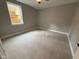 Cozy bedroom with neutral colored carpet and large window at 3380 N Pine Song Dr, Martinsville, IN 46151