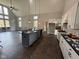 Open concept kitchen with an island and high ceilings at 3380 N Pine Song Dr, Martinsville, IN 46151