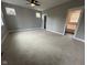 Spacious bedroom with gray walls, carpet flooring, and ample natural light at 3380 N Pine Song Dr, Martinsville, IN 46151