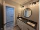 Bathroom with double vanity, large mirror, and modern lighting at 3380 N Pine Song Dr, Martinsville, IN 46151