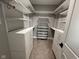 Bright walk-in closet with white shelving and drawers at 3380 N Pine Song Dr, Martinsville, IN 46151