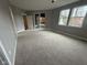 Large bedroom with gray walls, carpet flooring, and access to a deck at 3380 N Pine Song Dr, Martinsville, IN 46151