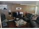 Cozy living room featuring a fireplace and dark leather seating at 3536 N Audubon Rd, Indianapolis, IN 46218