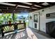 Relaxing covered porch with decorative accents and view of backyard at 12122 Bearsdale Dr, Indianapolis, IN 46235