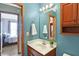 Bathroom with vanity, sink, and shower at 12122 Bearsdale Dr, Indianapolis, IN 46235