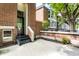 Front entrance with brick steps and a small patio area at 571 Lockerbie S Cir, Indianapolis, IN 46202