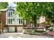 Brick townhouse with a two-car garage and landscaping at 571 Lockerbie S Cir, Indianapolis, IN 46202